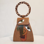 Load image into Gallery viewer, Handpainted Camel Colored Handbag Abstract Face (Clutch)
